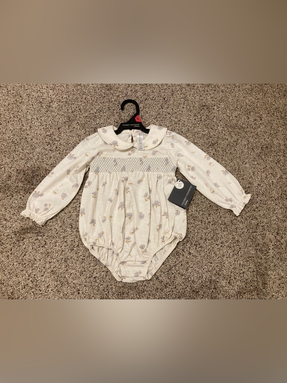 Modern Moments Smocked Cream Romper with Delicate Floral Accent